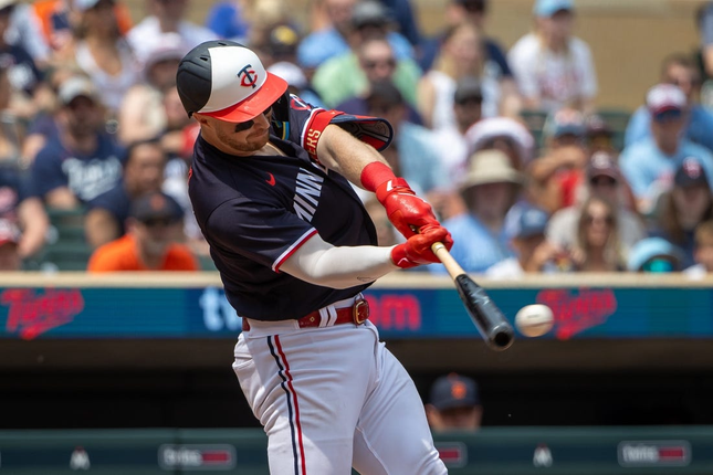 Jun 17, 2023; Minneapolis, MN, USA; Minnesota Twins catcher Ryan Jeffers (27) runs with Detroit Tigers outfielder selection in the fifth inning at Target Field base.